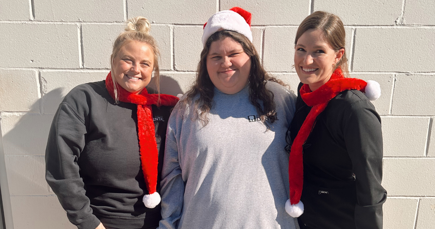 Bel Drive Dental staff wearing Christmas hats and scarves