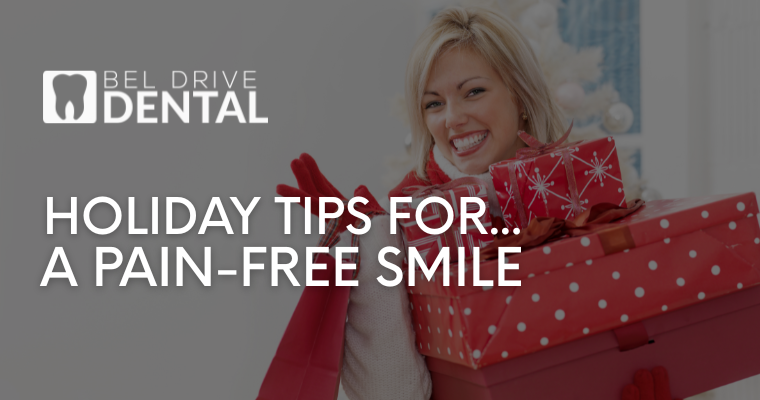 smiling woman in red holding red gift boxes